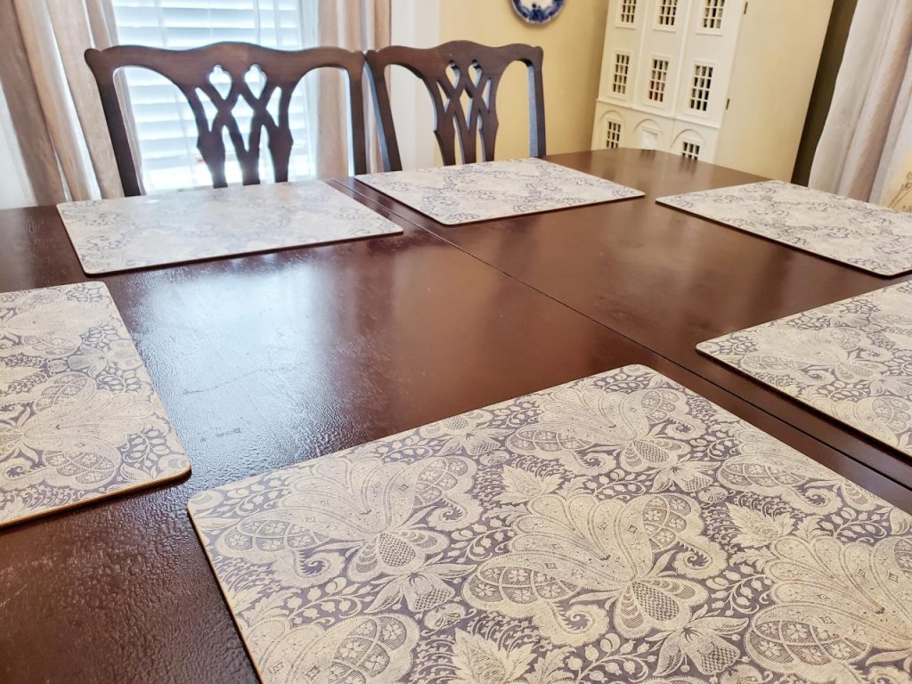 Placed placemats on the dining table when setting it for the Fall season.