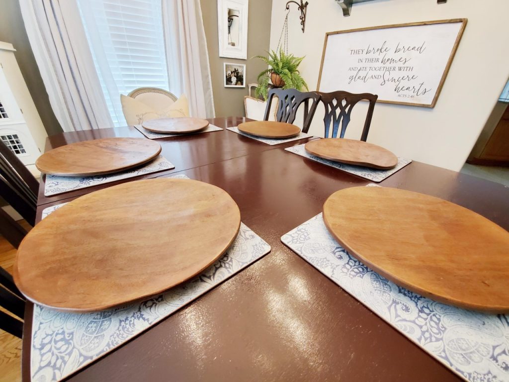 On top of the placemats, I put wood chargers to add a fall color when setting my table for the Fall season.