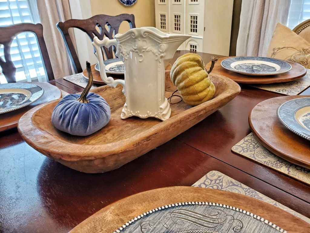 Adding a Victorian pitcher to the center of a dough bowl for a Rustic Victorian look when setting the table for the Fall season.