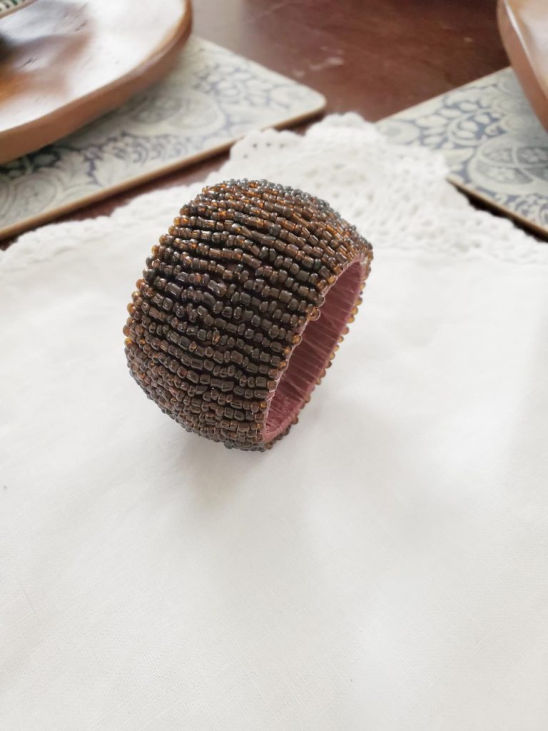 Brown beaded napkin ring used while setting my table for the fall season.