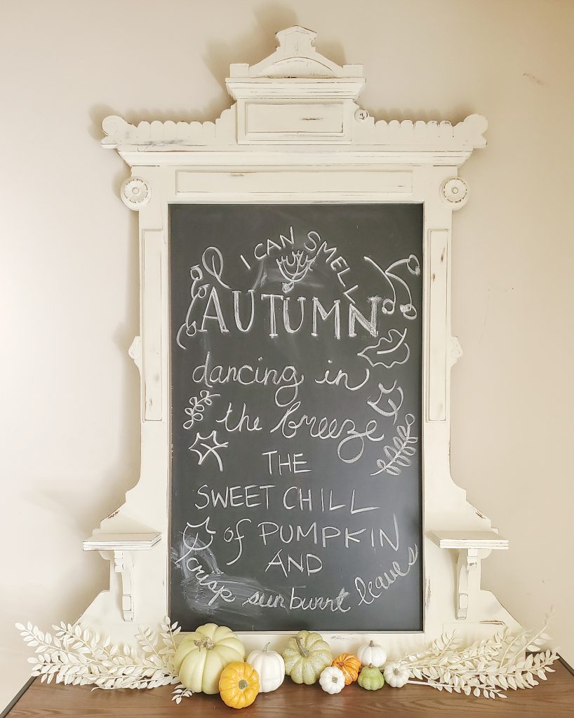 Fireplace mantle with a Autumn saying in our fireside room that is decorated for Fall.