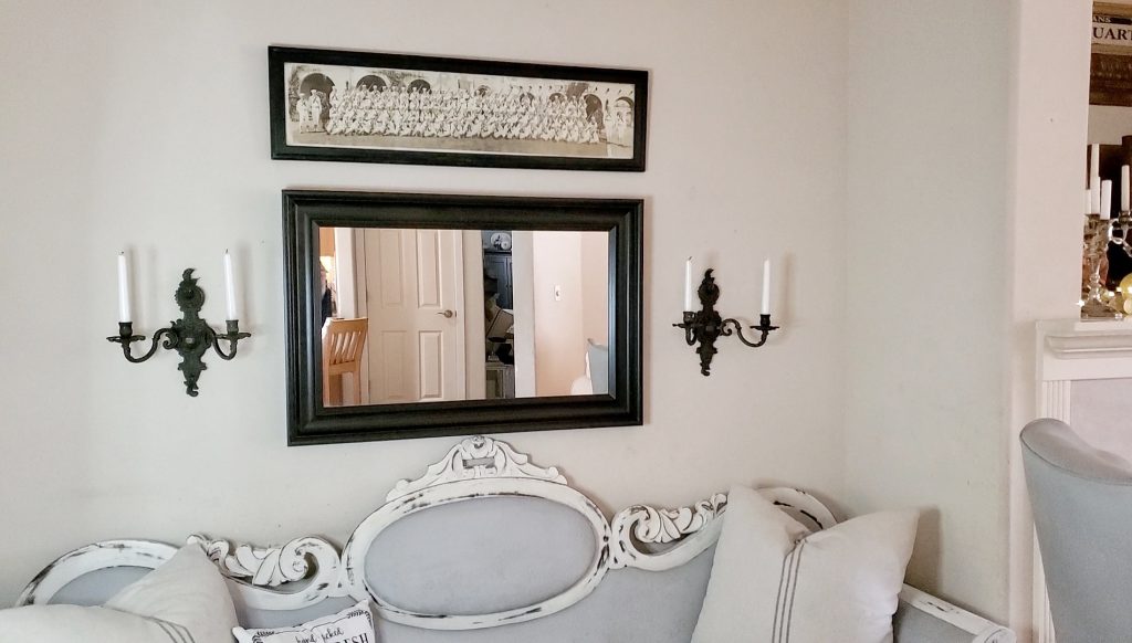View of the mirror and sconces in our fireside room that is decorated for Fall.