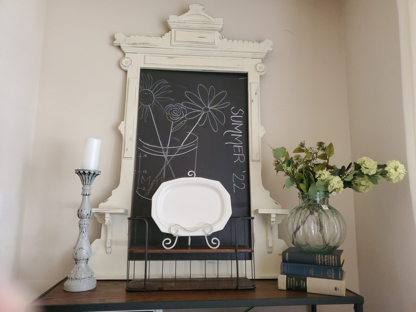 Decorate with light & dark colors. White platter in front of a blackboard pops!