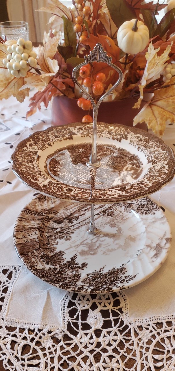 Decorate with light & dark colors by placing the transferware tier tray on top of white lace tablecloth.