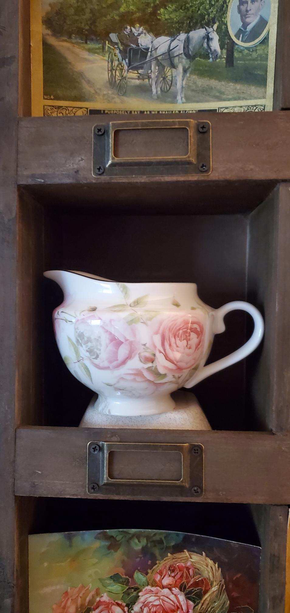 Pink floral creamer found at Goodwill.