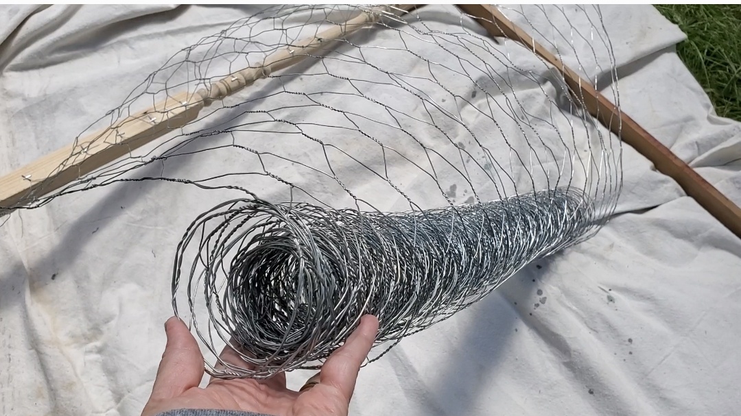 Unrolling the chicken coop wire.