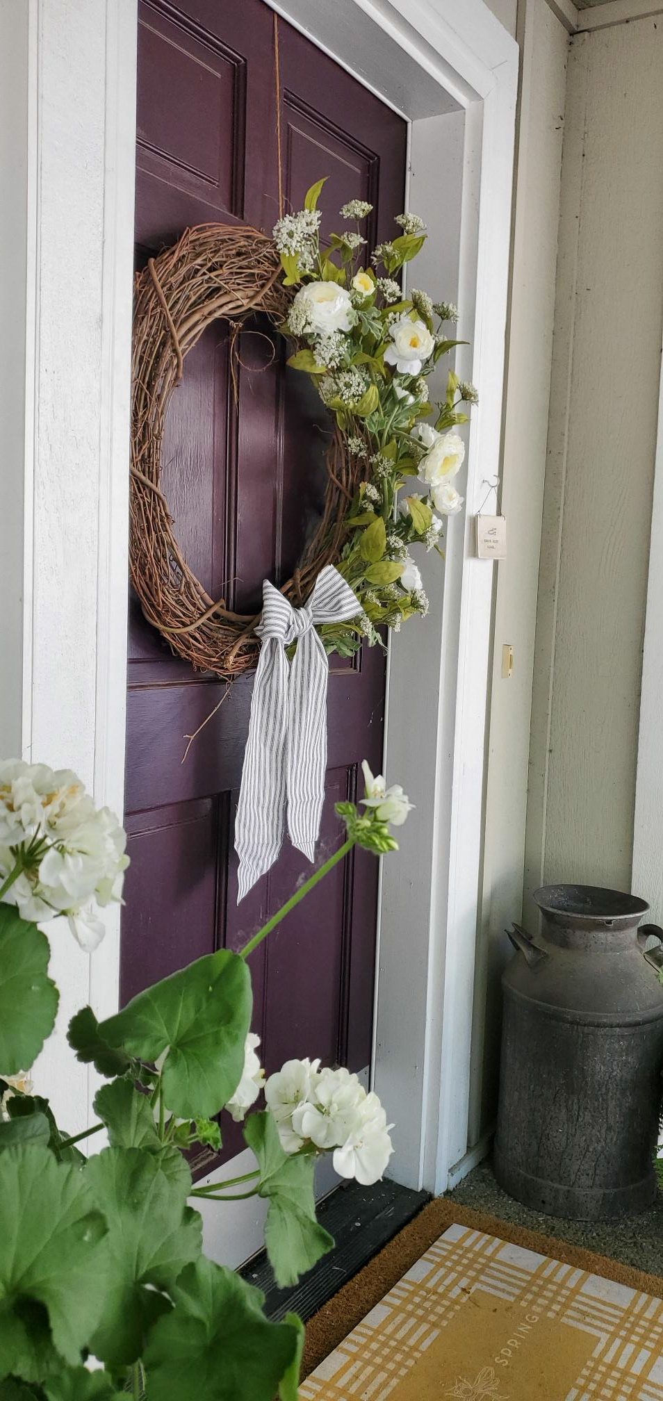 No wire Summer wreath hung on front door.