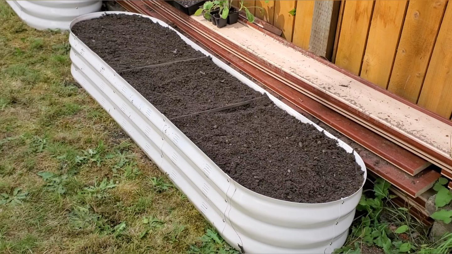 Raised bed filled with soil.