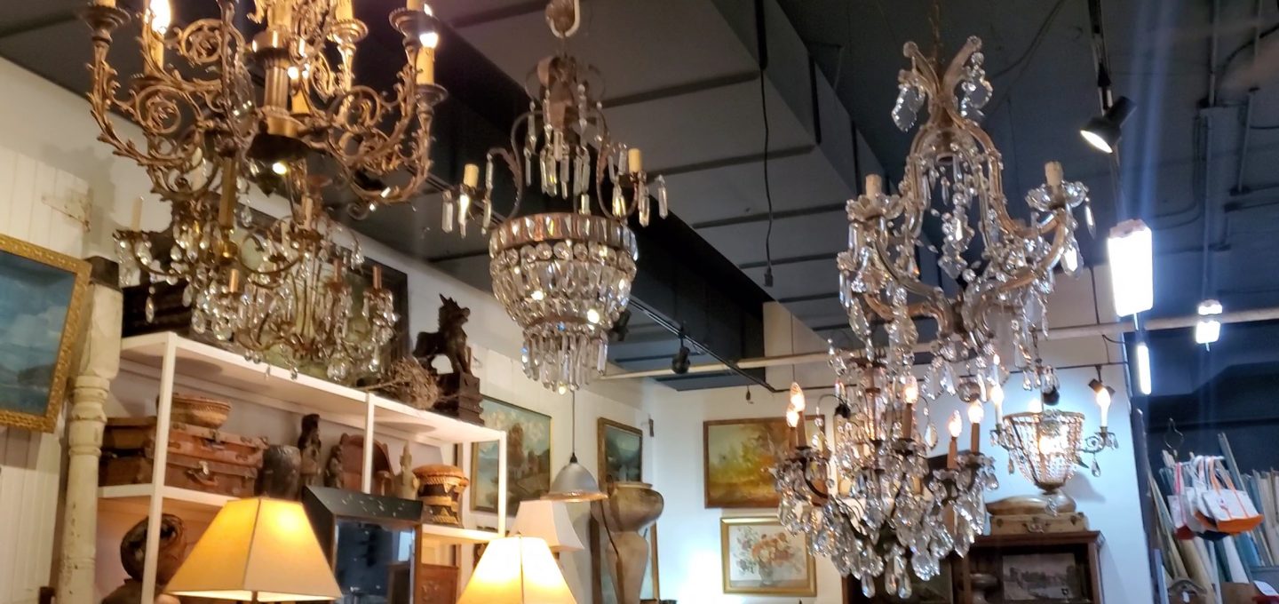 Antique chandeliers in Oscar & Co antique store.