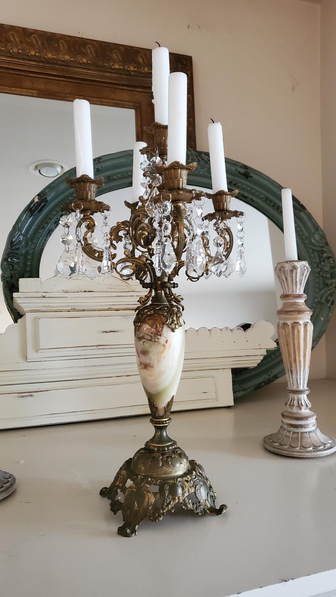 Antique brass candelabra on our fireplace mantle. Decorating with vintage style.