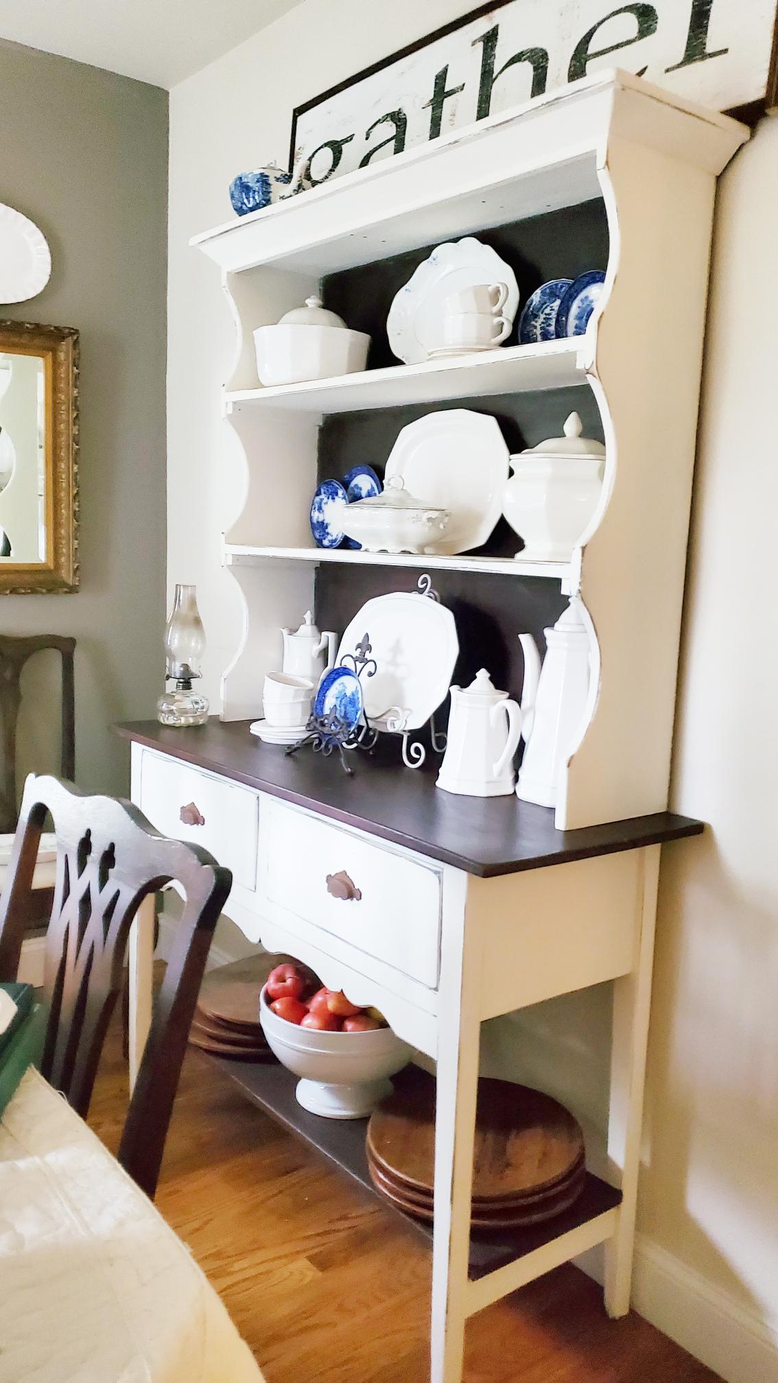 White farmhouse hutch in dining room.